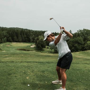 someone golfing in herring cove